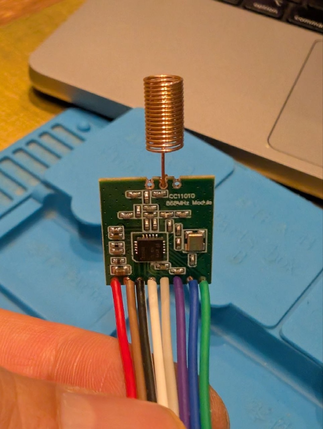 A generic CC1101 868 MHz module — note the silver crystal and the helical coil antenna. Make sure the silkscreen says 868, not 433.