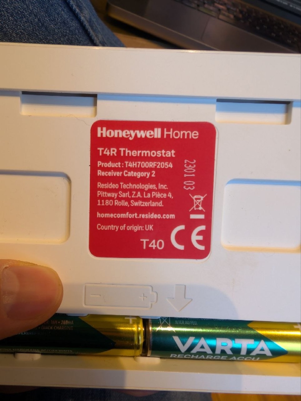 The back of the T4R room thermostat — model T4H700RF2054, made early 2023.